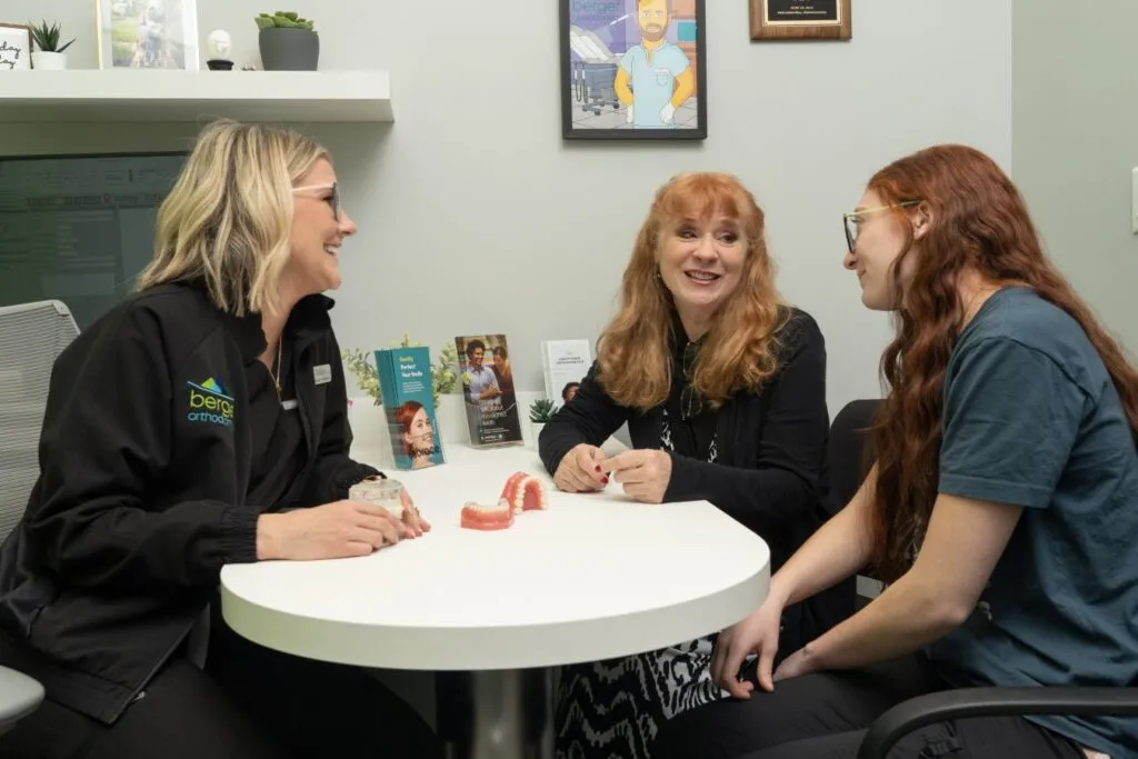 Berger Orthodontics team consulting with patient about Invisalign and braces treatment options.