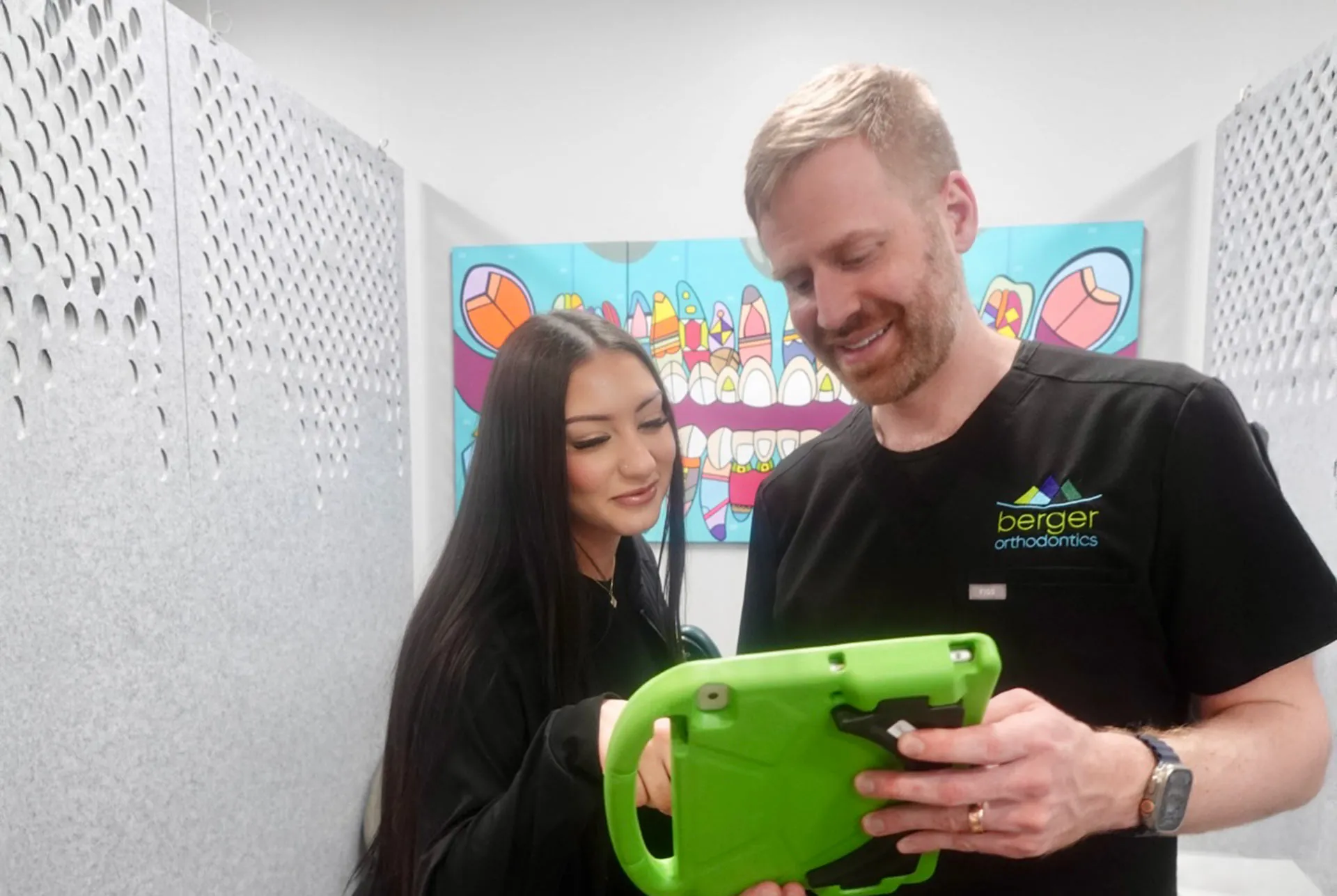 Dr. Berger with tech and ipad